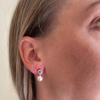 model wearing pearl and CZ earrings