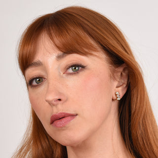 Model wearing Terri  rose Gold Clip On Earrings,  crystal clip-ons
