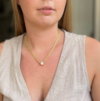 Model wearing Valora Gold Necklace, CZ ball pendant on chain