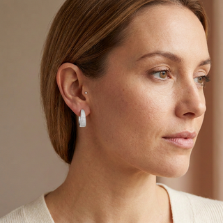 Model wearing Cabo Silver Hoop Earrings