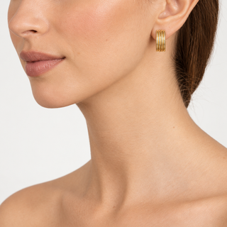 Model wearing Callen Gold Clip On Earrings