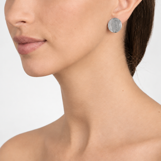 Model wearing Caspain Silver Clip On Earrings