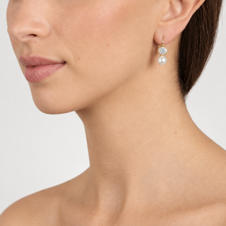 Colour model image wearing Mimi gold lever-back earrings
