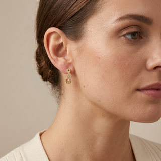 Freya gold hoop earrings on-model image