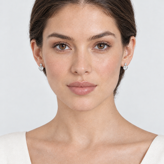 Full-face model wearing silver Posy Simple earrings