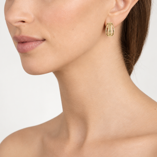 Model wearing Maddy Gold Clip On Earrings