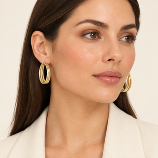 Model wearing Kala gold hoop earrings