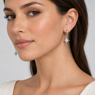 Model wearing North Star silver huggie earrings