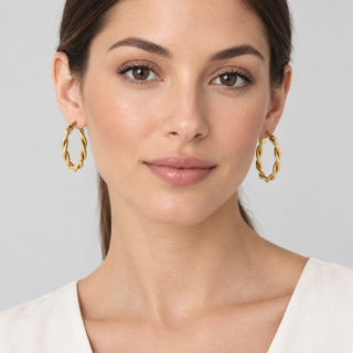 Model wearing Olena gold hoop earrings at 3 cm scale