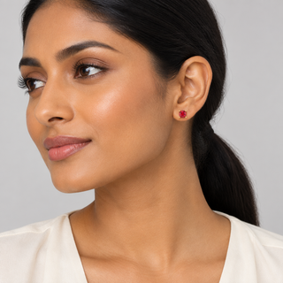 New model wearing Laine 6 mm Ruby gold earrings