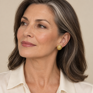 Model wearing Tyra Gold Clip On Earrings