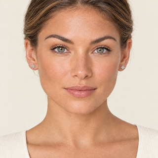 North Star silver earrings in the cream studio model portrait