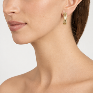Model wearing Panola Gold Clip On Earrings