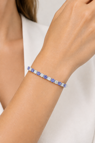 Revised bracelet with alternating clear and tanzanite stones